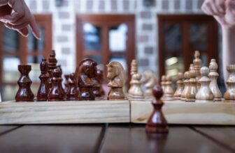 You Can Play Chess in Hyperbolic Area Now, and It Sucks